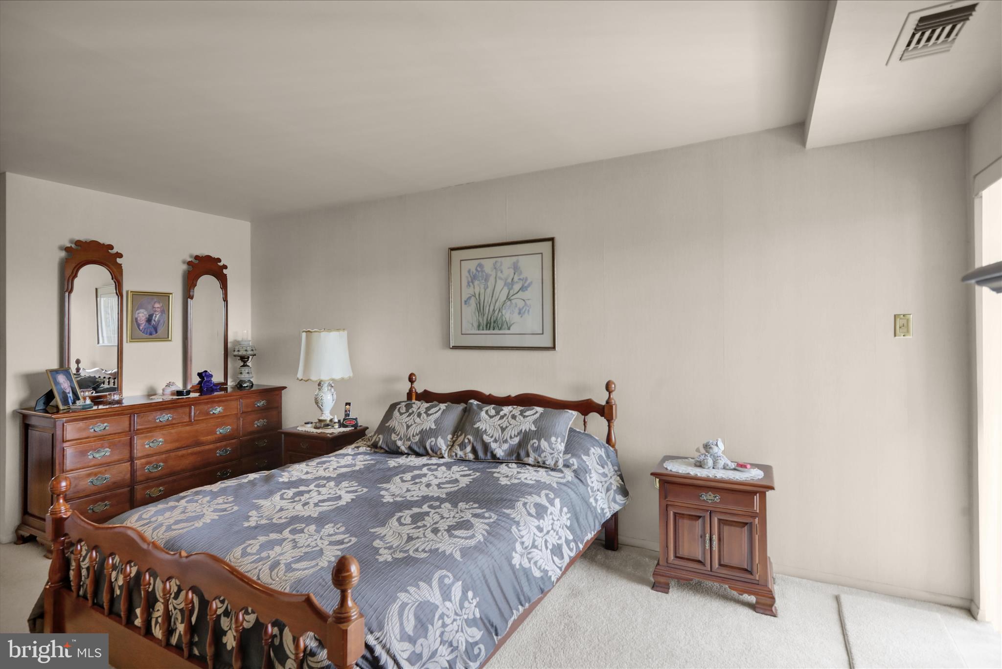 1375 Pershing Boulevard, Unit 201 Reading, PA 19607 - Photo 11 of 24 a bedroom with a bed and dresser