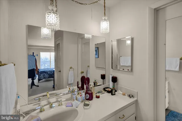 a bathroom with a sink double vanity and a mirror