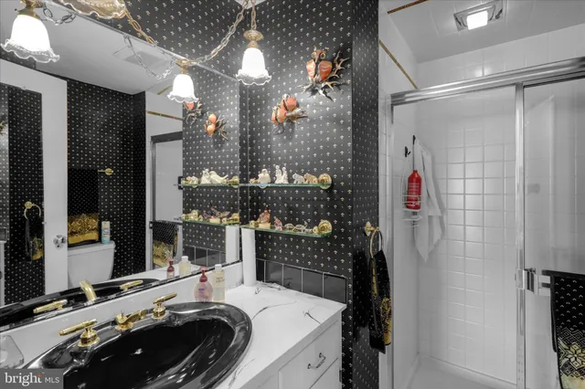 a bathroom with a sink and a shower