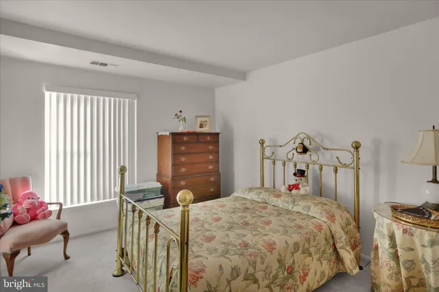 a bed room with furniture and a window