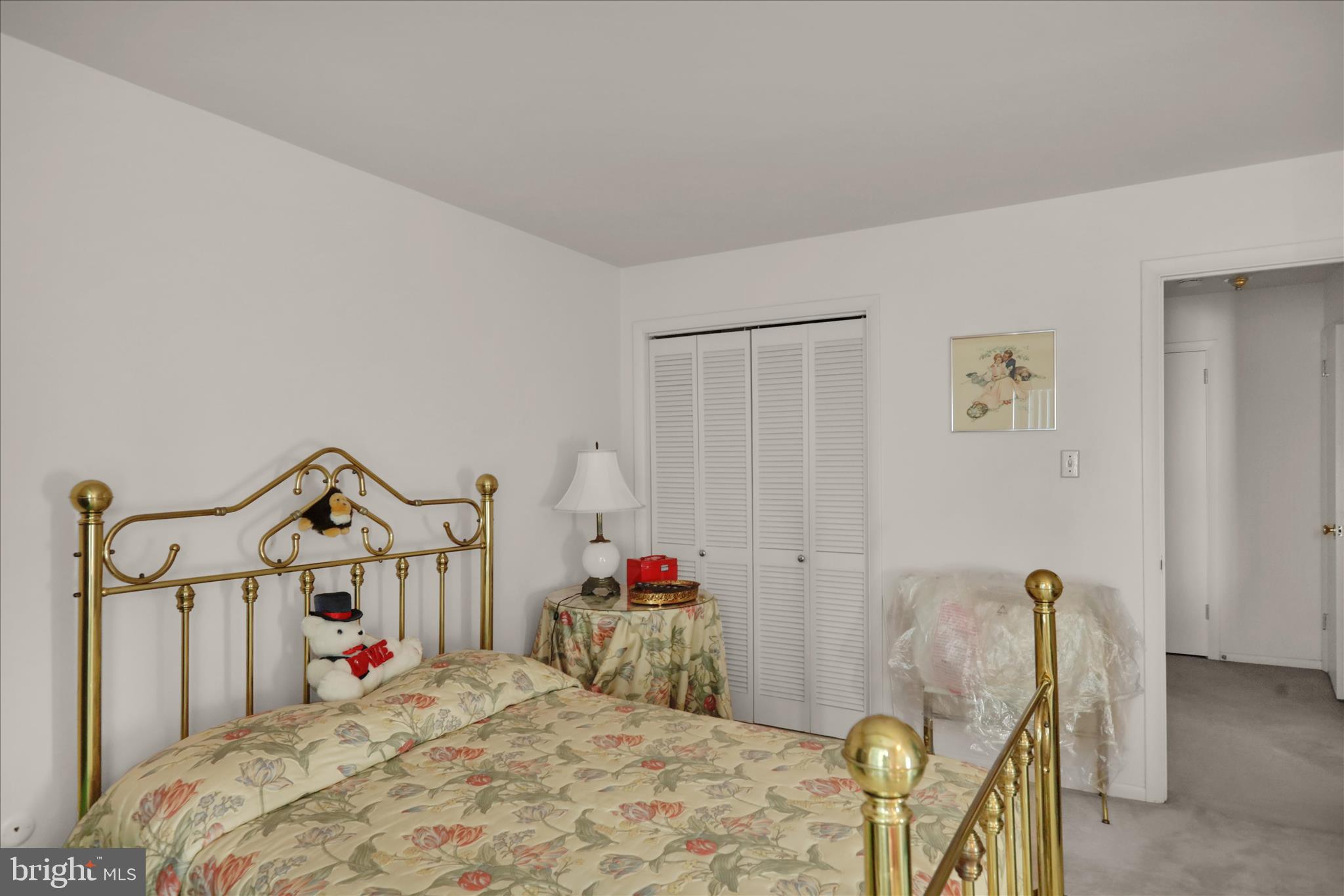 1375 Pershing Boulevard, Unit 201 Reading, PA 19607 - Photo 17 of 24 a bed room with a bed and a chandelier