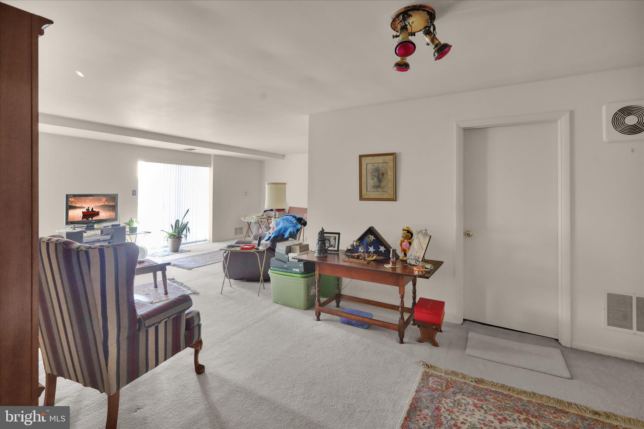 1375 Pershing Boulevard, Unit 201 Reading, PA 19607 - Photo 22 of 24 a view of a livingroom with dining room and natural light