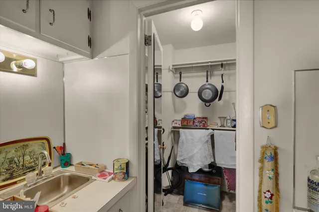 a bathroom with a sink mirror and vanity