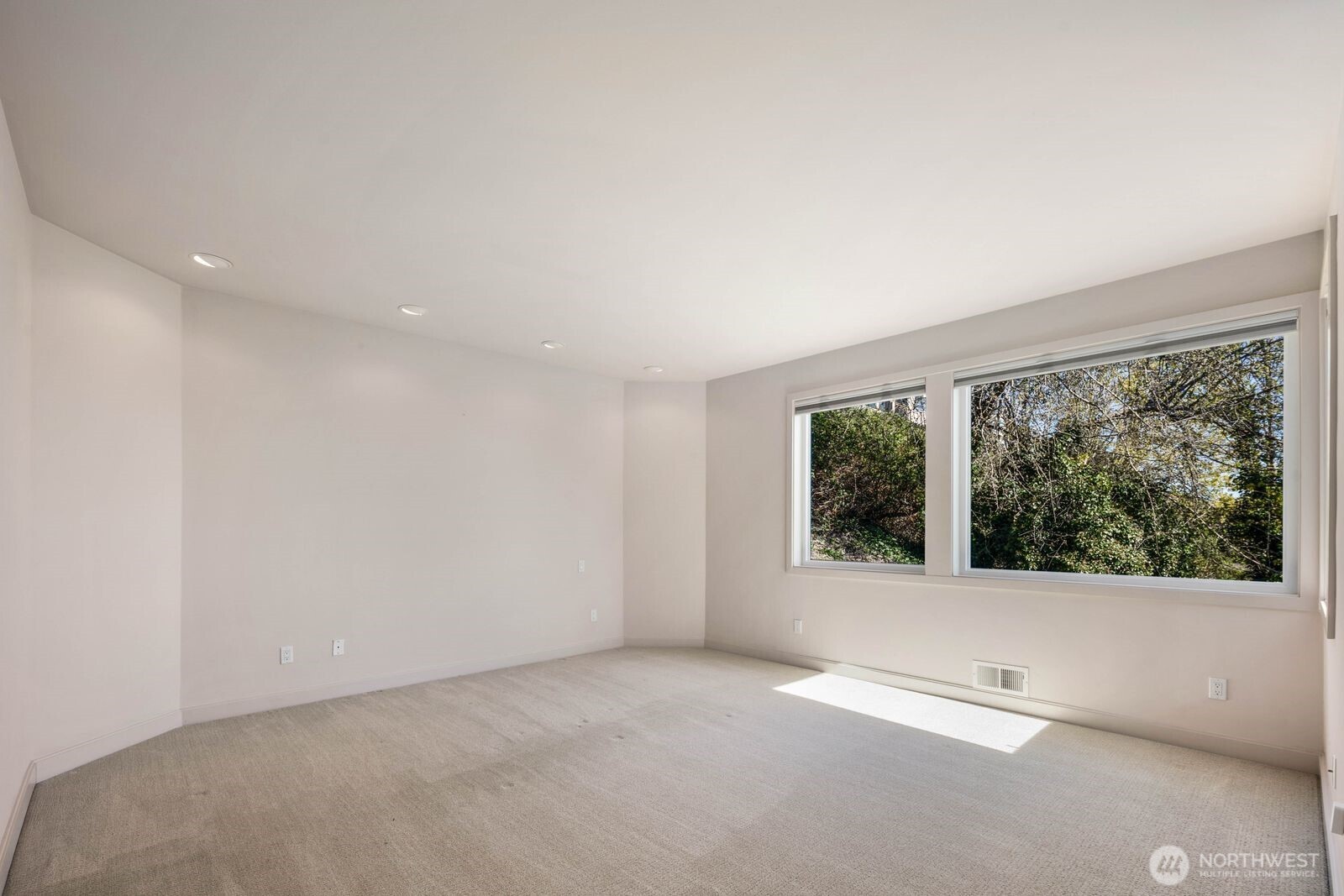 1717 Ferry Avenue Southwest Seattle, WA 98116 - Photo 23 of 40 a view of an empty room with a window