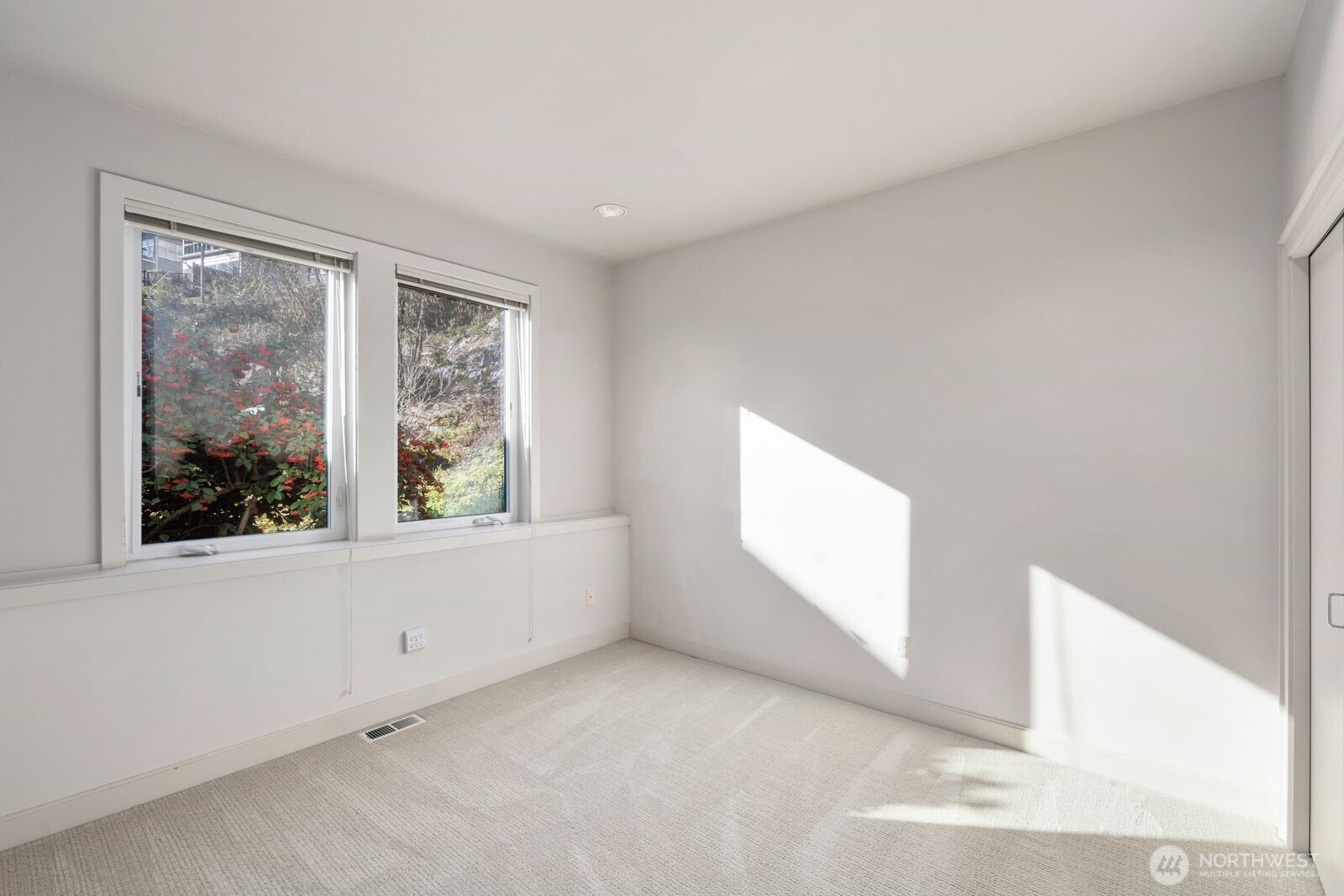 1717 Ferry Avenue Southwest Seattle, WA 98116 - Photo 31 of 40 an empty room with windows