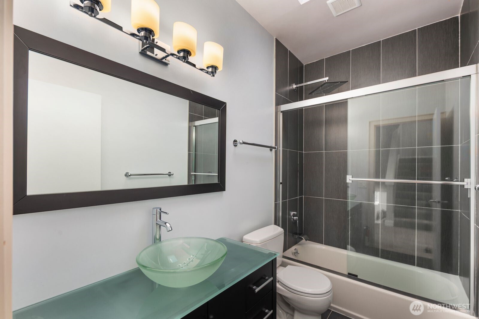 1717 Ferry Avenue Southwest Seattle, WA 98116 - Photo 33 of 40 a bathroom with a sink a toilet and shower