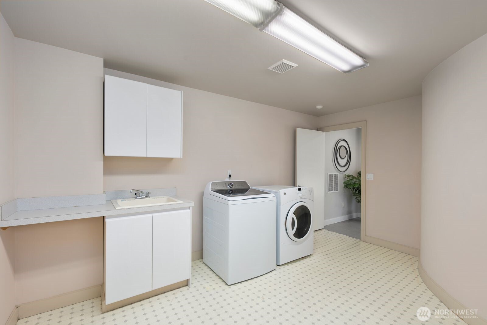 1717 Ferry Avenue Southwest Seattle, WA 98116 - Photo 34 of 40 a view of storage and utility room with washer and dryer