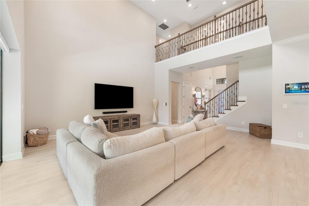 10175 Brocksport Circle Gotha, FL 34734 - Photo 6 of 54 a living room with furniture and a flat screen tv