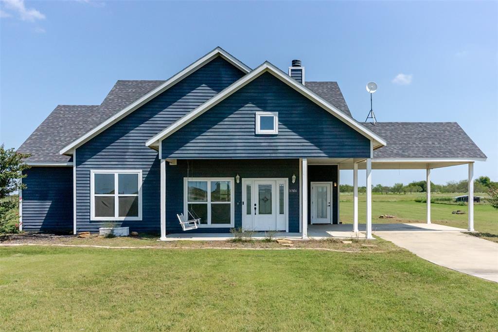 16806 Fm 3486 Terrell, TX 75160 - Photo 1 of 21 View of front of home with a porch, a front yard, roof with shingles, and a chimney