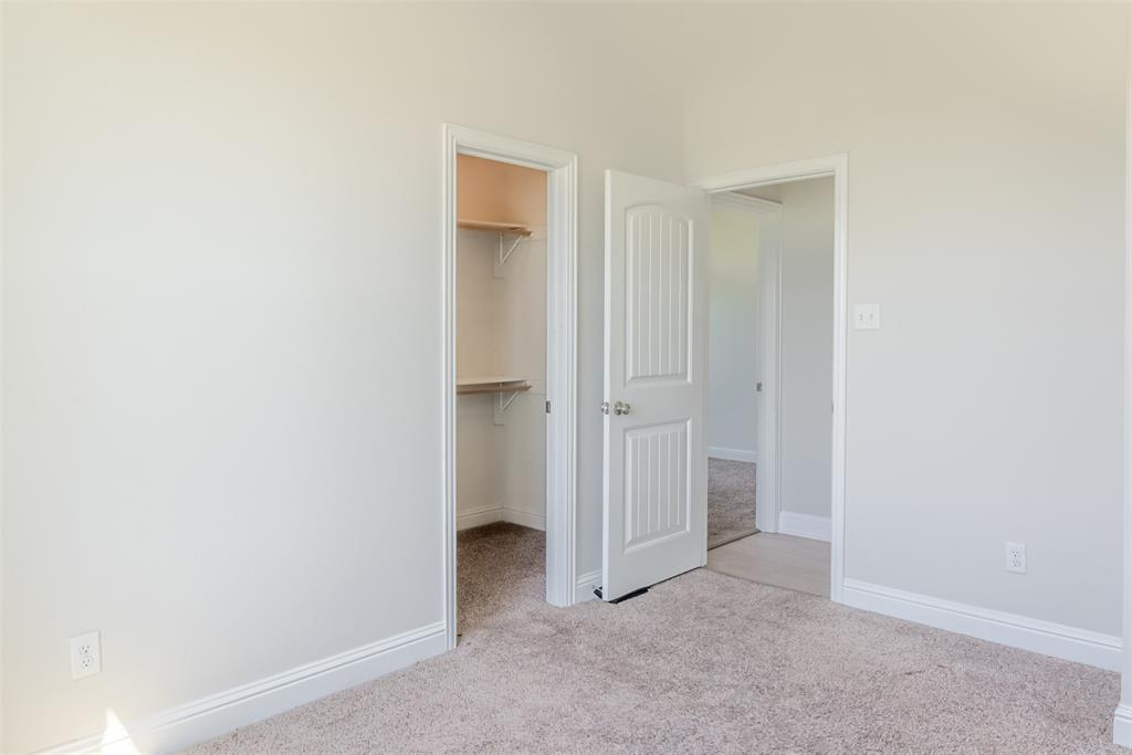 16806 Fm 3486 Terrell, TX 75160 - Photo 14 of 21 Unfurnished bedroom with light colored carpet and a spacious closet