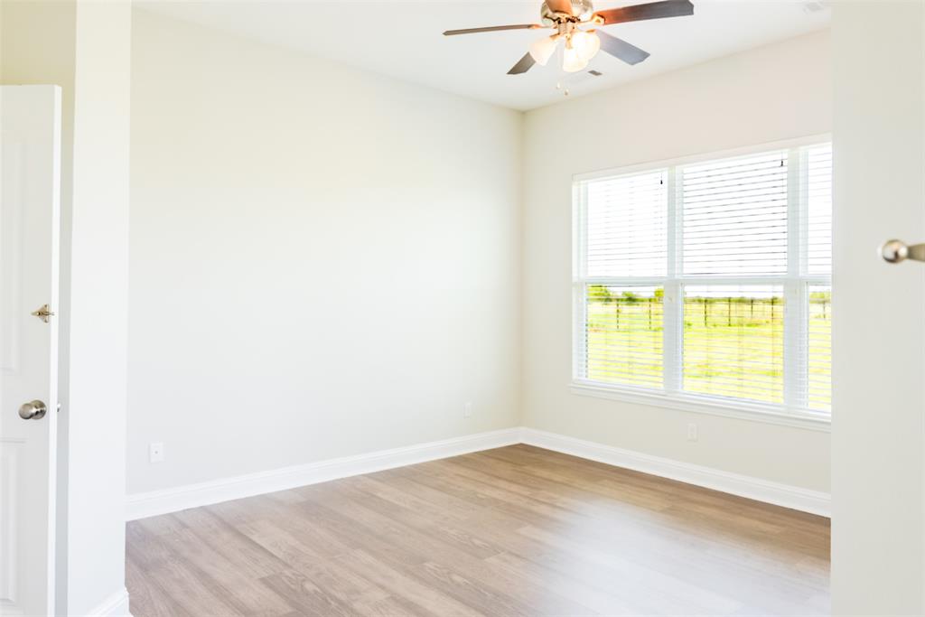 16806 Fm 3486 Terrell, TX 75160 - Photo 16 of 21 Spare room featuring light wood finished floors and ceiling fan