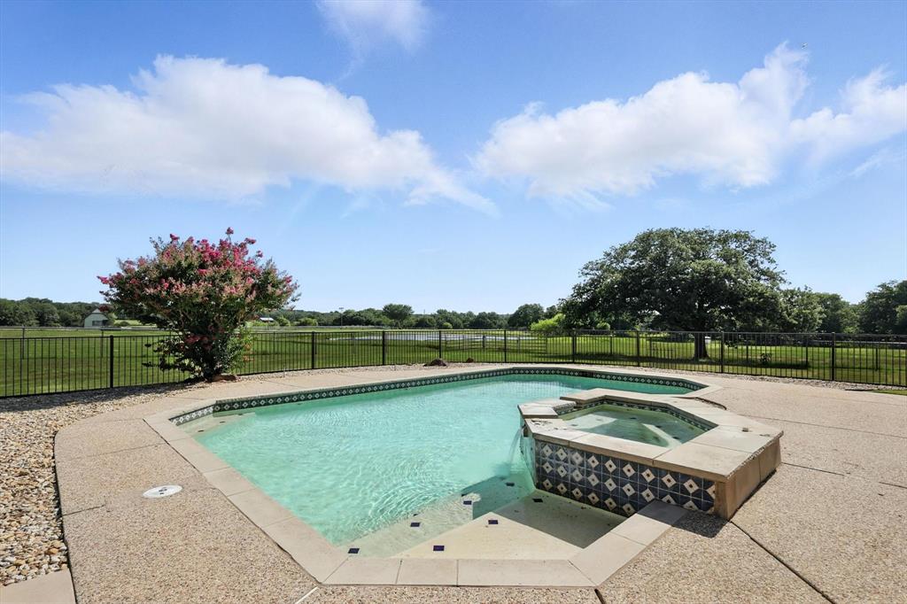 12886 St John Road Pilot Point, TX 76258 - Photo 27 of 35 View of pool with a pool with connected hot tub
