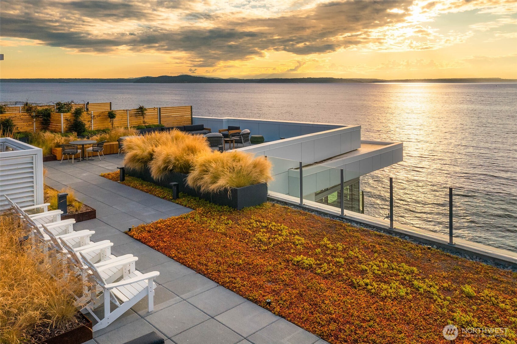 1250 Alki Avenue Southwest, Unit 3H Seattle, WA 98116 - Photo 13 of 38 a view of roof deck with two chairs and potted plants