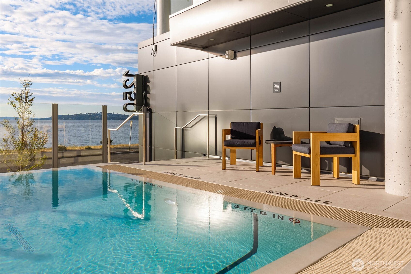 1250 Alki Avenue Southwest, Unit 3H Seattle, WA 98116 - Photo 24 of 38 a swimming pool with view of lake