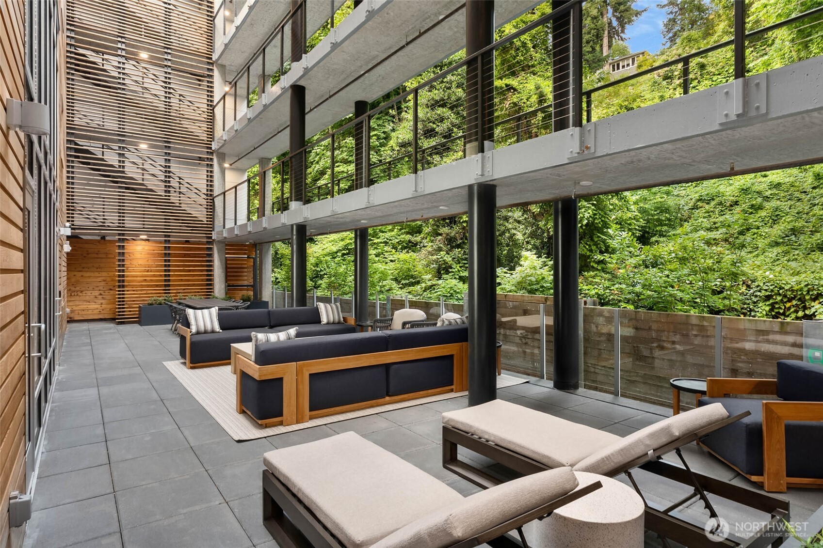1250 Alki Avenue Southwest, Unit 3H Seattle, WA 98116 - Photo 37 of 38 a outdoor space with patio the couches and chairs