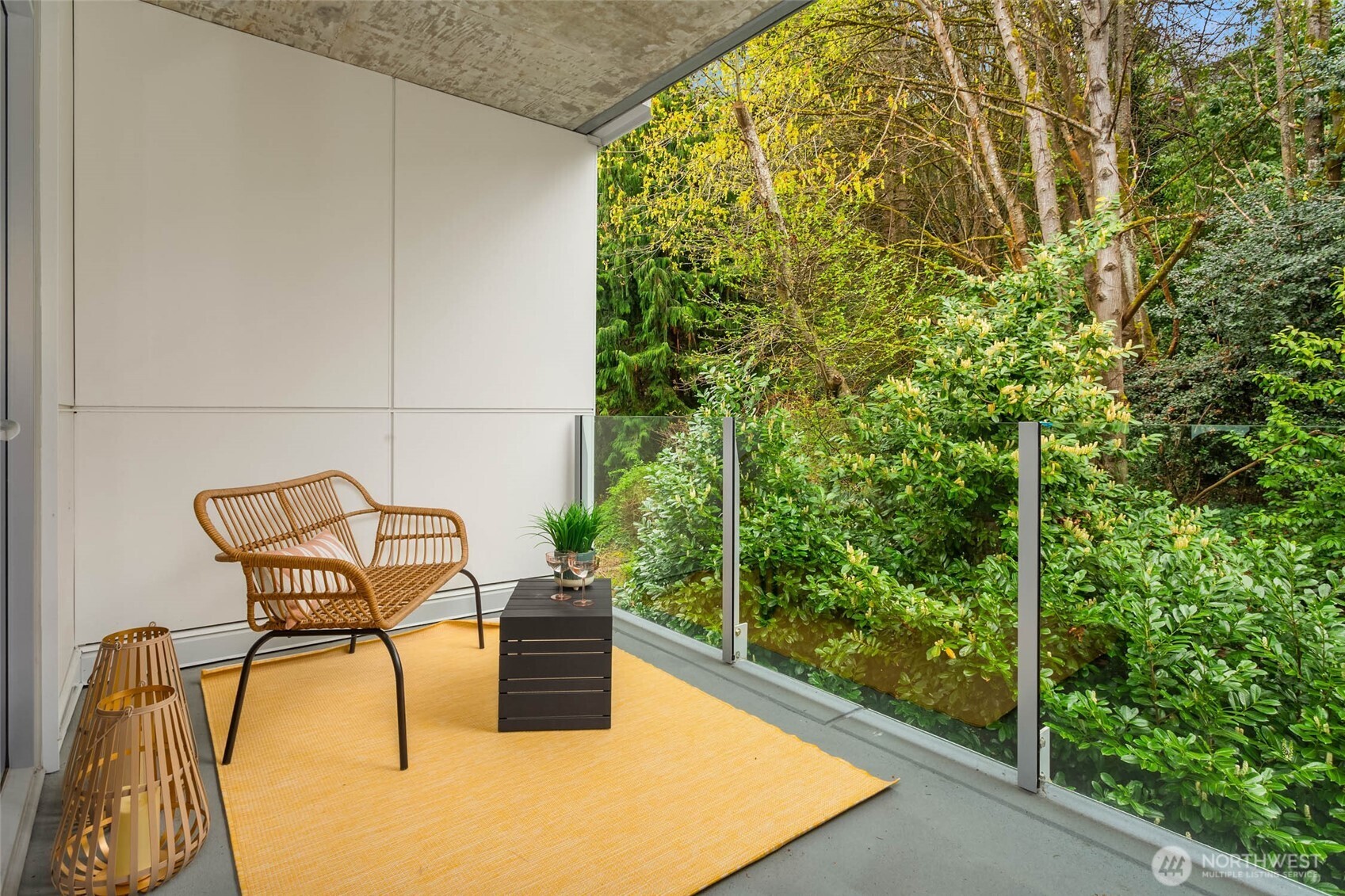 1250 Alki Avenue Southwest, Unit 3H Seattle, WA 98116 - Photo 6 of 38 a roof deck with table and chairs and potted plants