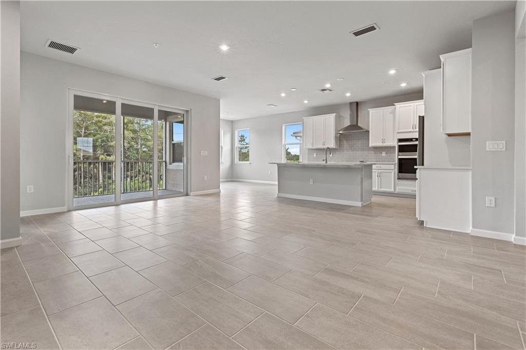 4670 Arboretum Circle, Unit 203 Naples, FL 34112 - Photo 19 of 33 a view of kitchen and windows