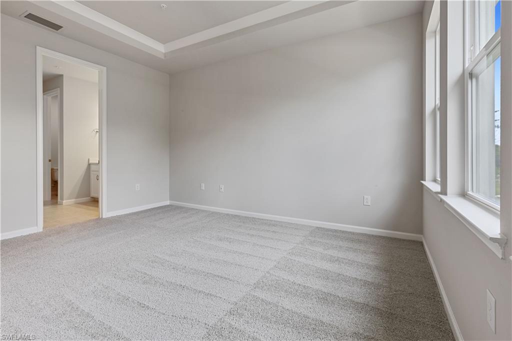 4670 Arboretum Circle, Unit 203 Naples, FL 34112 - Photo 25 of 33 an empty room with a window