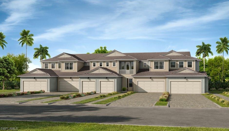 4670 Arboretum Circle, Unit 203 Naples, FL 34112 - Photo 3 of 33 a front view of a house with a garden and parking