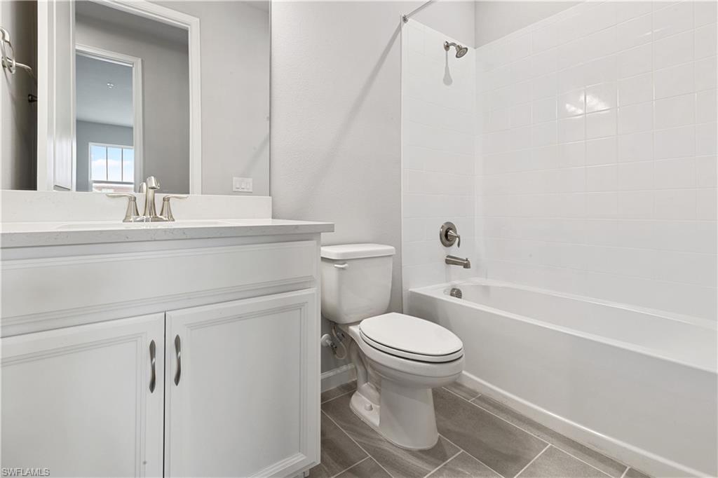4670 Arboretum Circle, Unit 203 Naples, FL 34112 - Photo 31 of 33 a bathroom with a sink toilet and shower