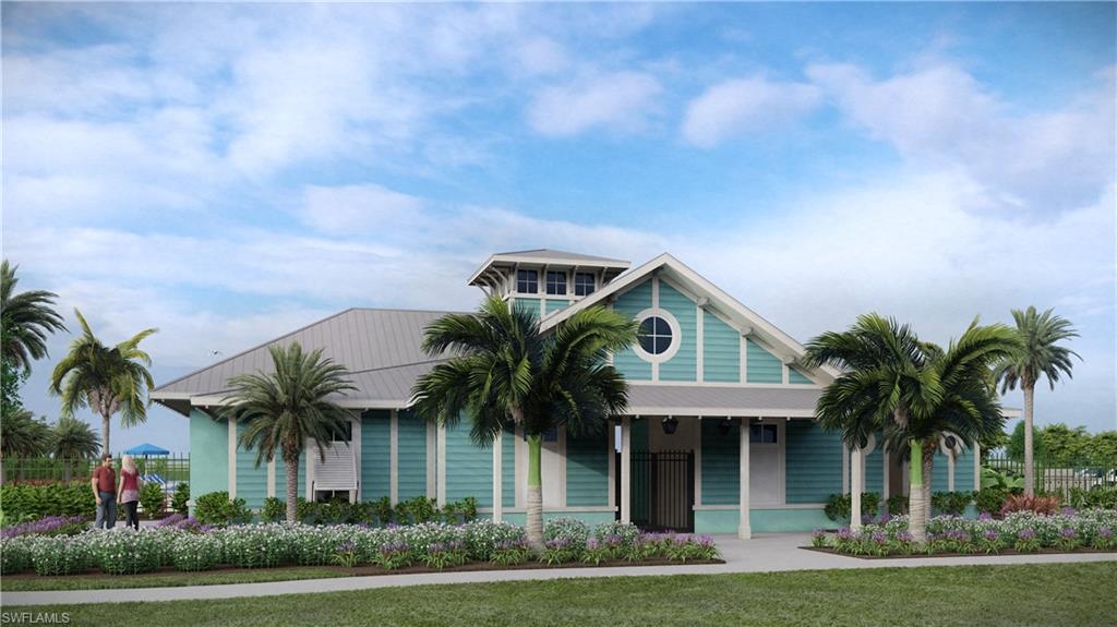 4670 Arboretum Circle, Unit 203 Naples, FL 34112 - Photo 6 of 33 a front view of a house with a garden and trees