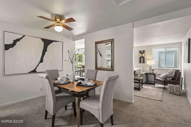 a dining room with furniture and window