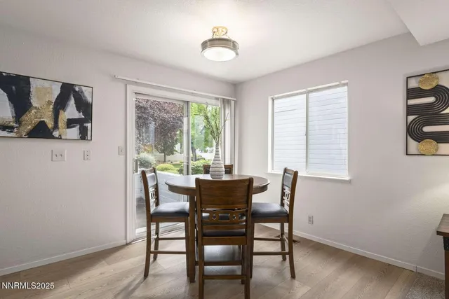 a dining room with furniture and window