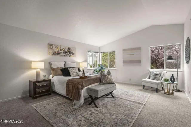 a bedroom with a bed and glass window