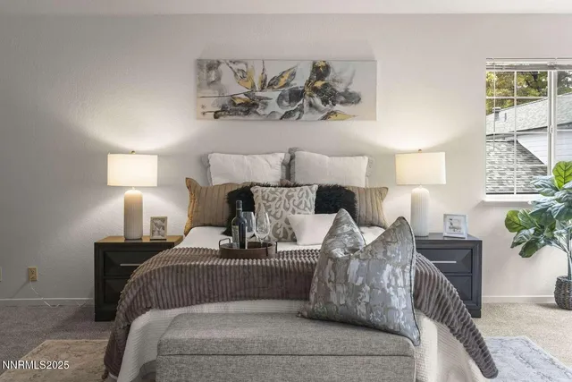 a bed room with a bed and a lamp