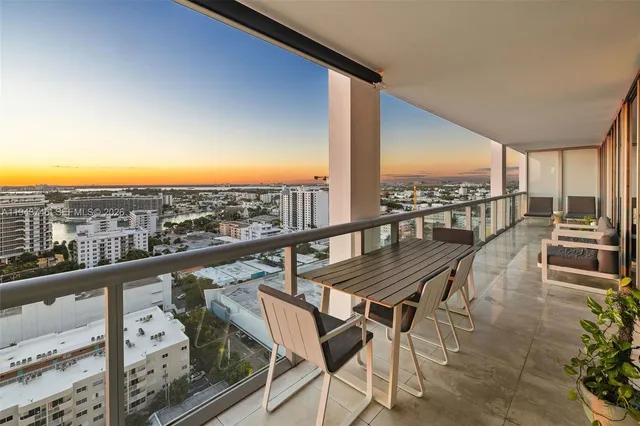 a view of a balcony with chairs