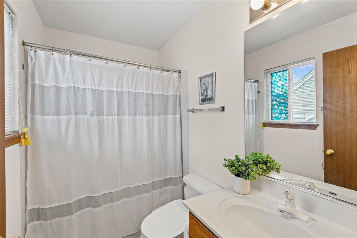 808 Violet Circle Naperville, IL 60540 - Photo 11 of 31 a bathroom with a sink toilet and shower