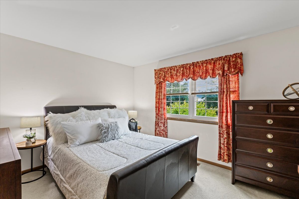 808 Violet Circle Naperville, IL 60540 - Photo 12 of 31 a bedroom with a bed and a dresser