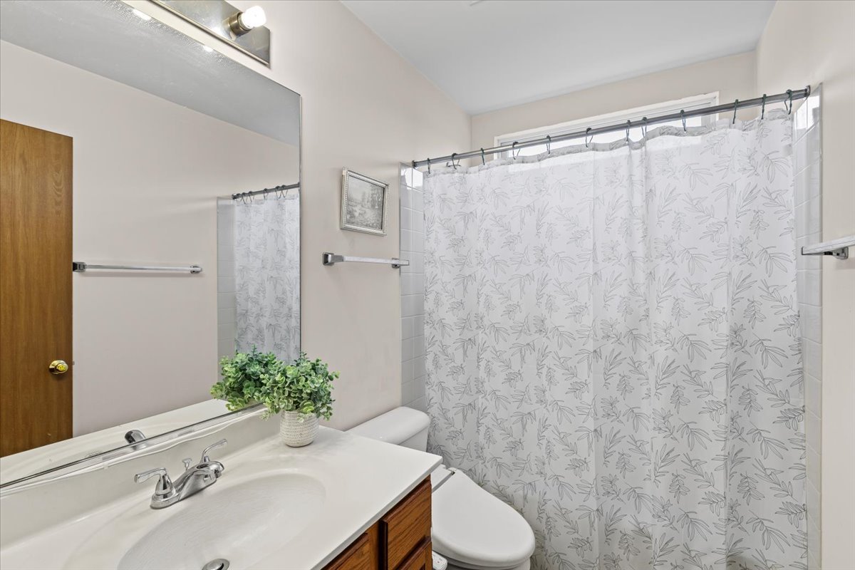 808 Violet Circle Naperville, IL 60540 - Photo 14 of 31 a bathroom with a sink toilet and shower