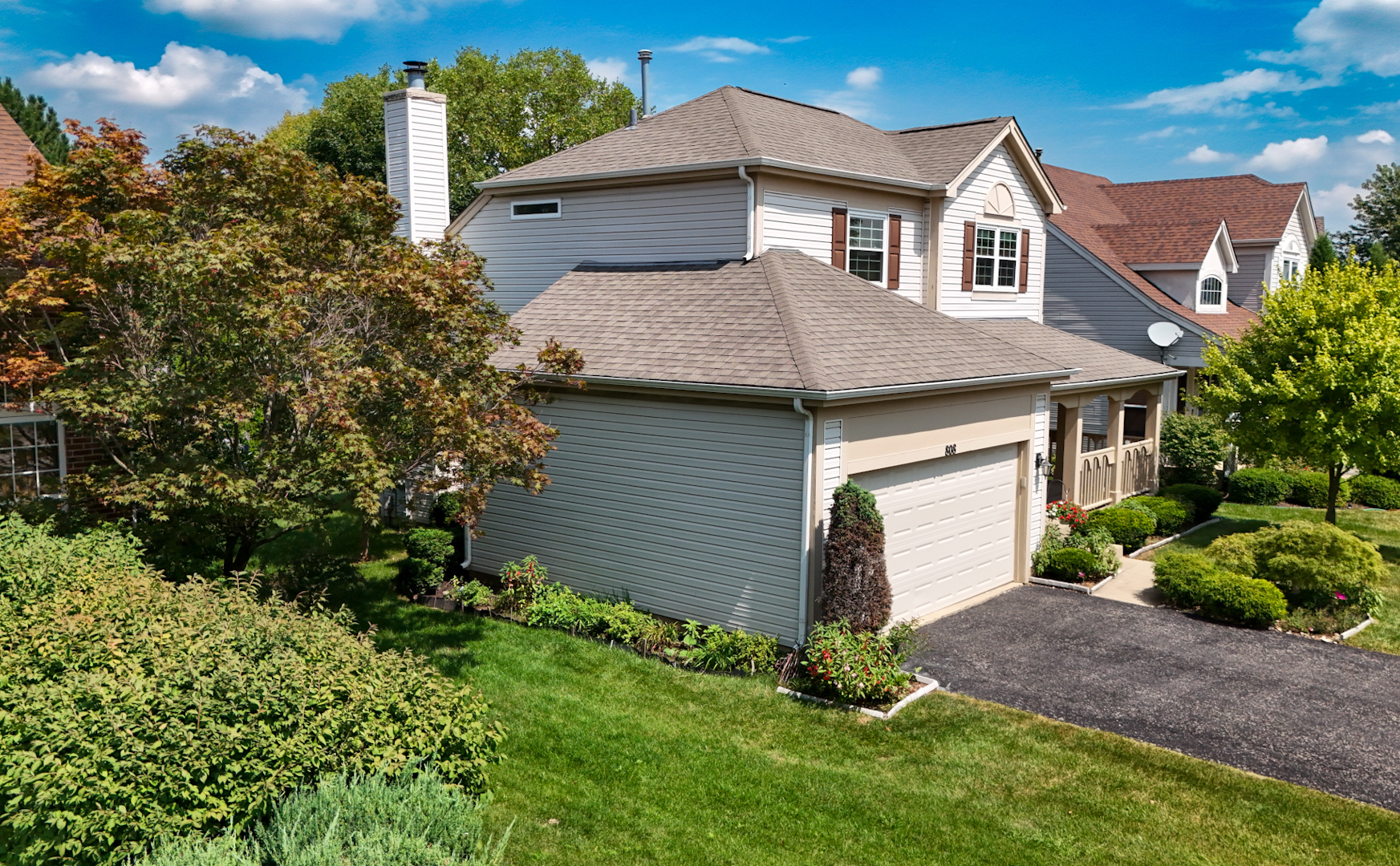 808 Violet Circle Naperville, IL 60540 - Photo 25 of 31 a front view of a house with a yard and garage