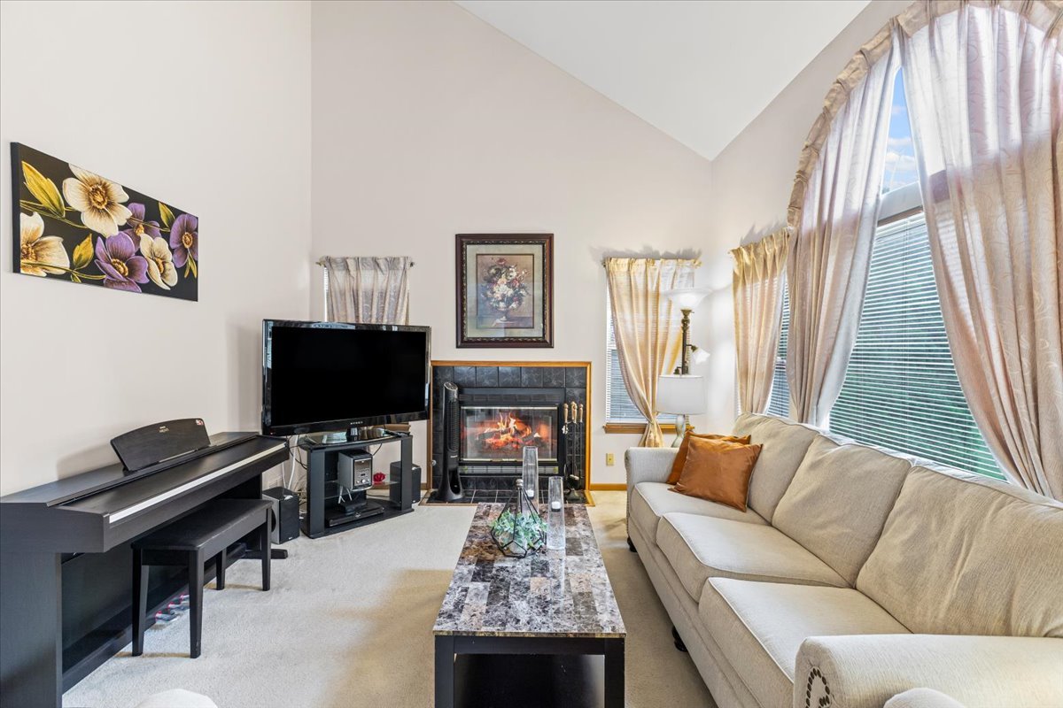 808 Violet Circle Naperville, IL 60540 - Photo 5 of 31 a living room with furniture and a flat screen tv