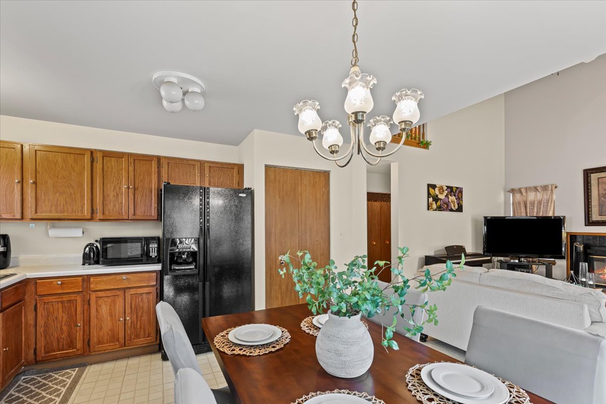 808 Violet Circle Naperville, IL 60540 - Photo 8 of 31 a kitchen with a refrigerator and microwave