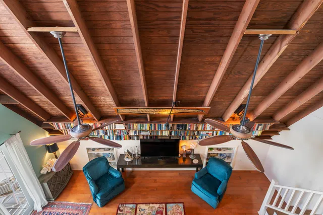 a balcony with furniture and a potted plant