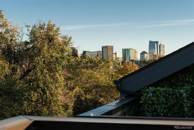 a view of a balcony with an outdoor seating