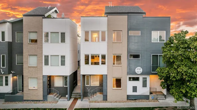 a front view of a house with plants
