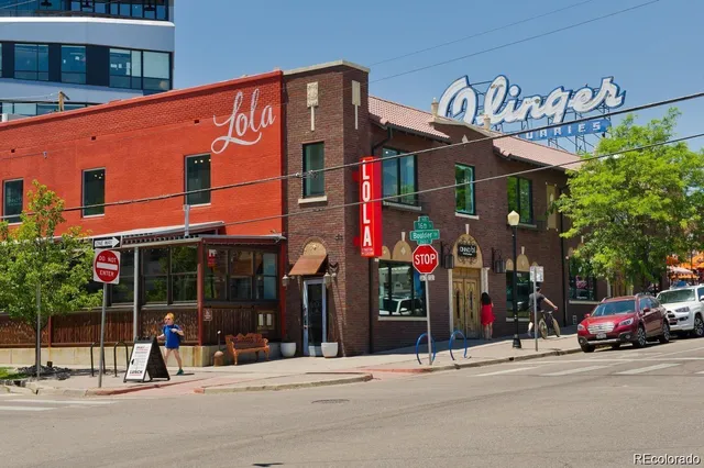 a backyard of a house with barbeque oven and outdoor seating