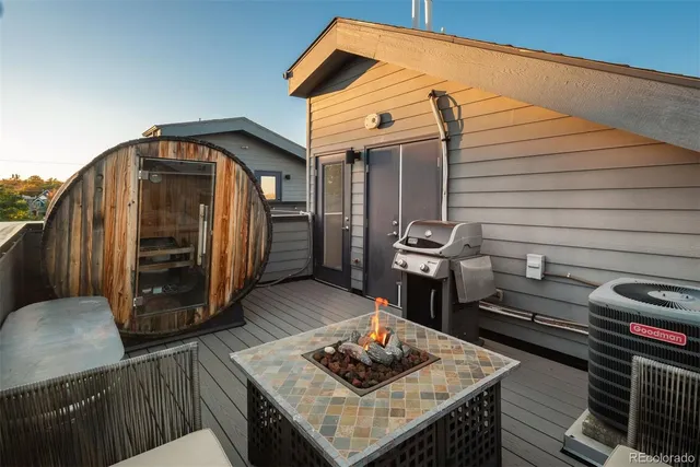 a front view of a house with plants and trees