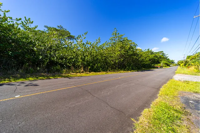 an aerial view of multiple houses with yard