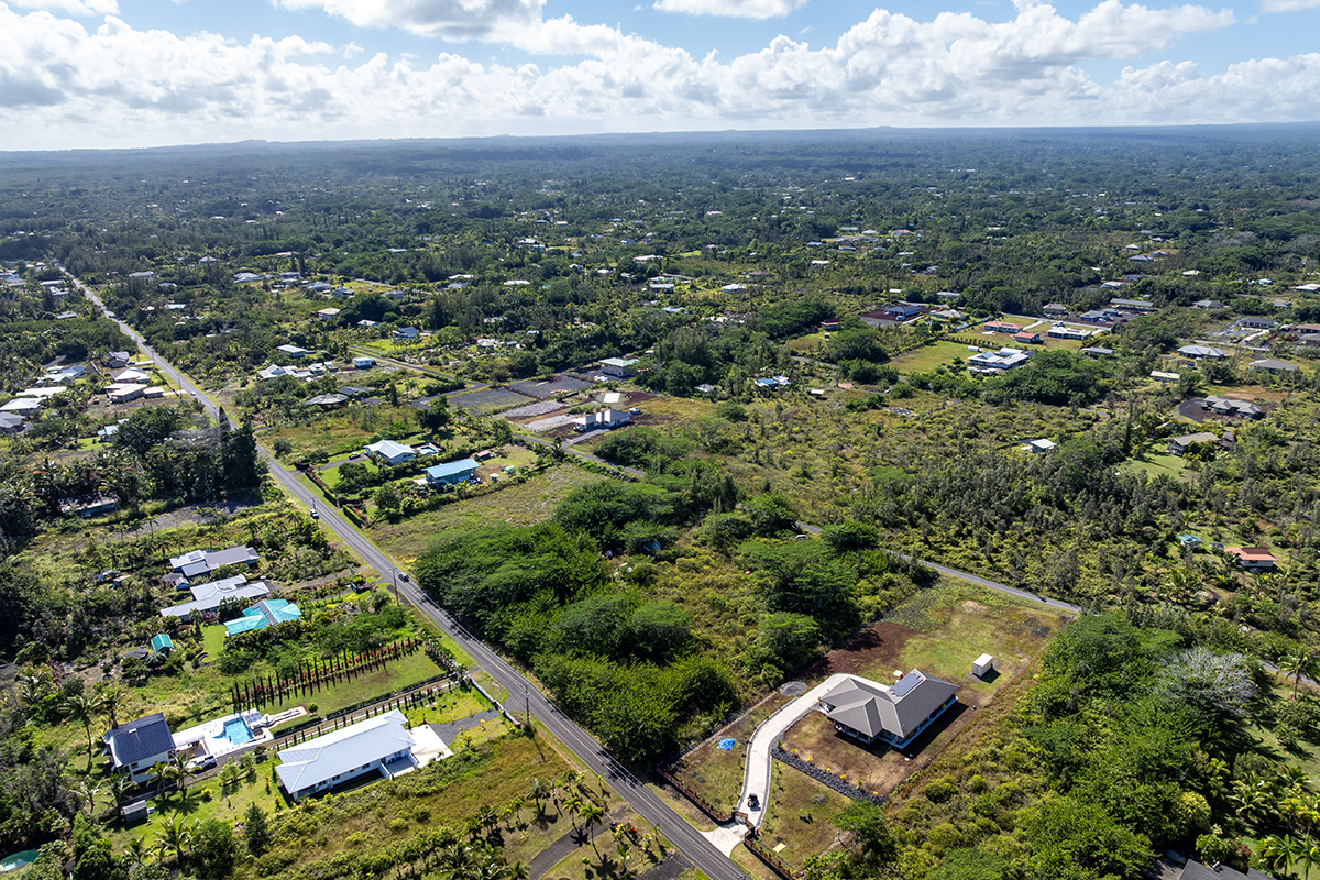 15-1576 Lot 3077 Beach Road Keaau, HI 96749 - Photo 10 of 23 an aerial view of multiple houses with yard