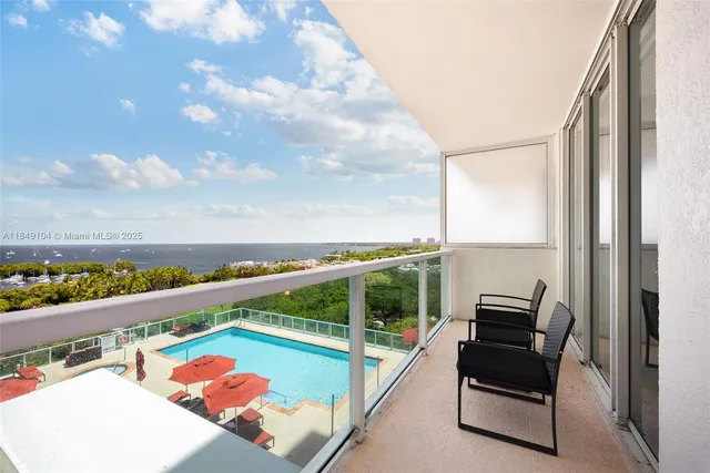 a view of city from balcony with seating space