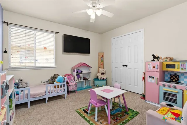 a bedroom with bed and a window