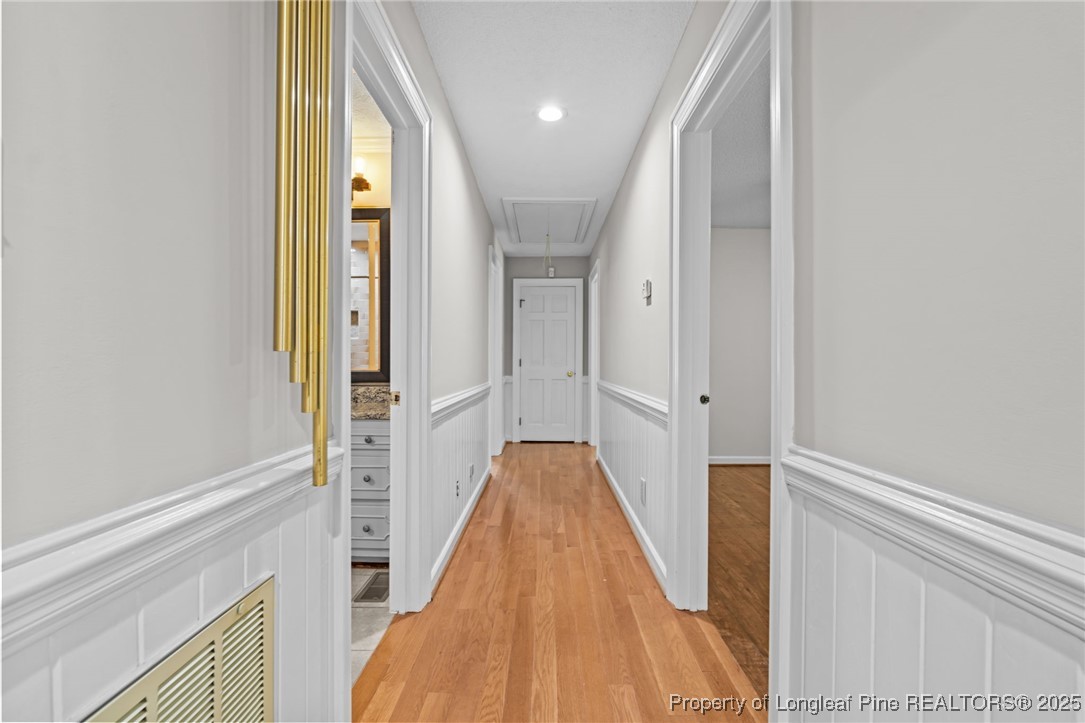 610 Maynard Lake Road Erwin, NC 28339 - Photo 20 of 49 a view of a hallway with wooden floor and staircase