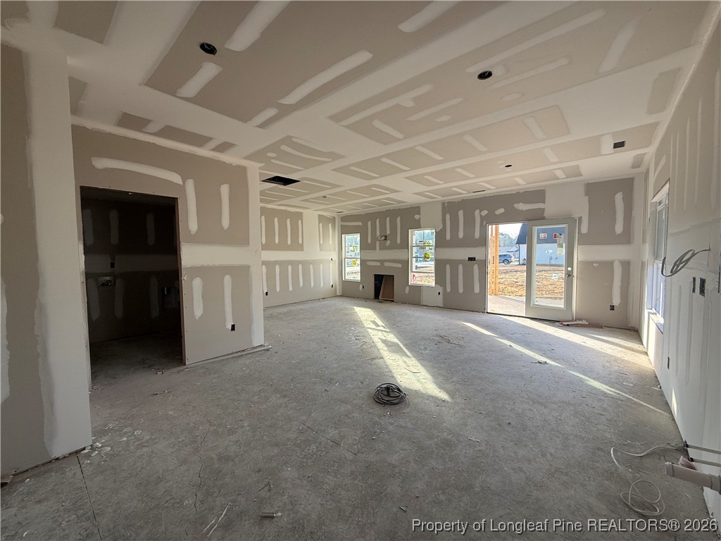 2118 Smith Road Hope Mills, NC 28348 - Photo 11 of 14 a living room with furniture and a refrigerator