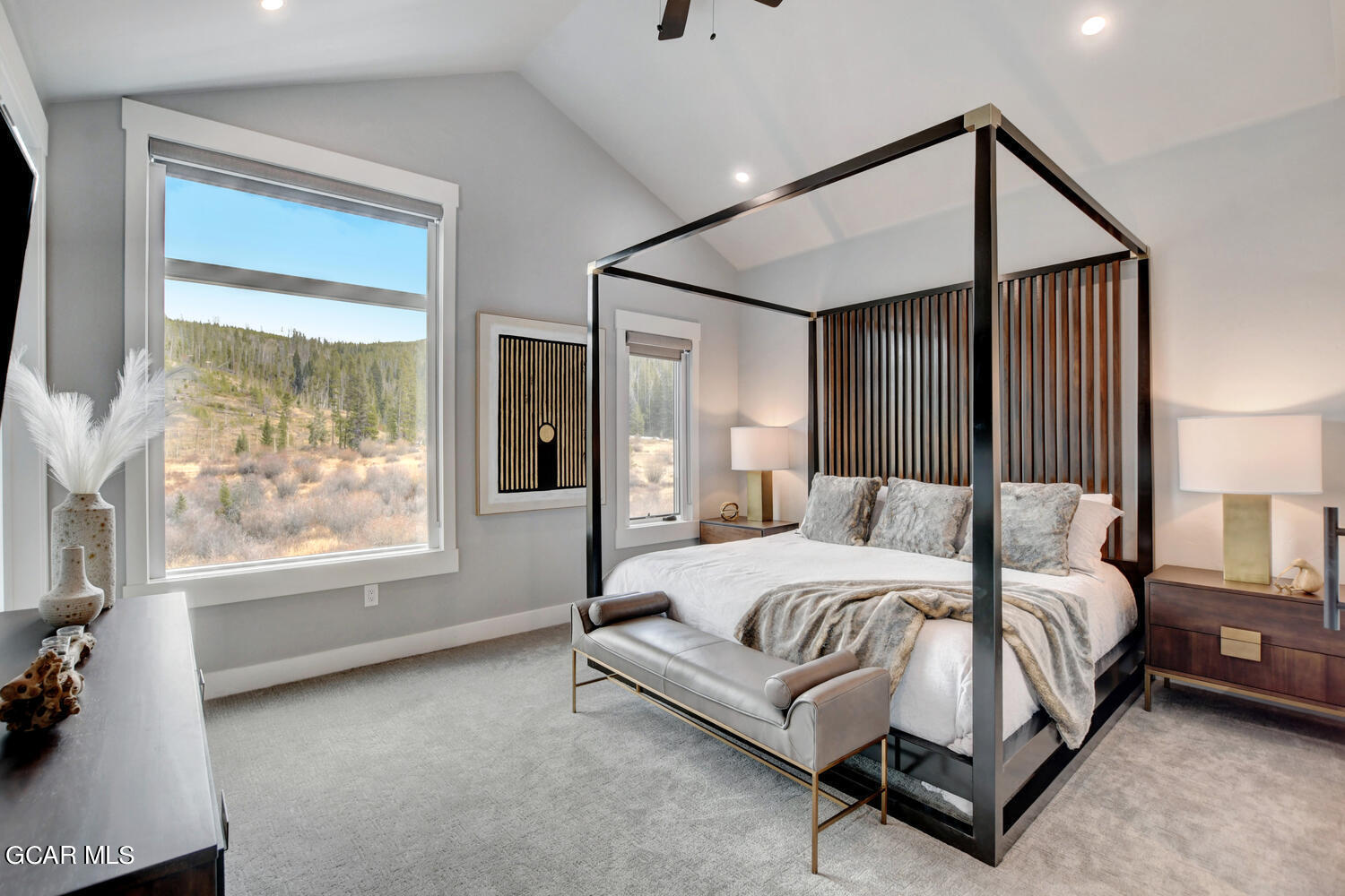 Undisclosed Address Winter Park, CO 80482 - Photo 16 of 52 a bedroom with a large bed and a large window