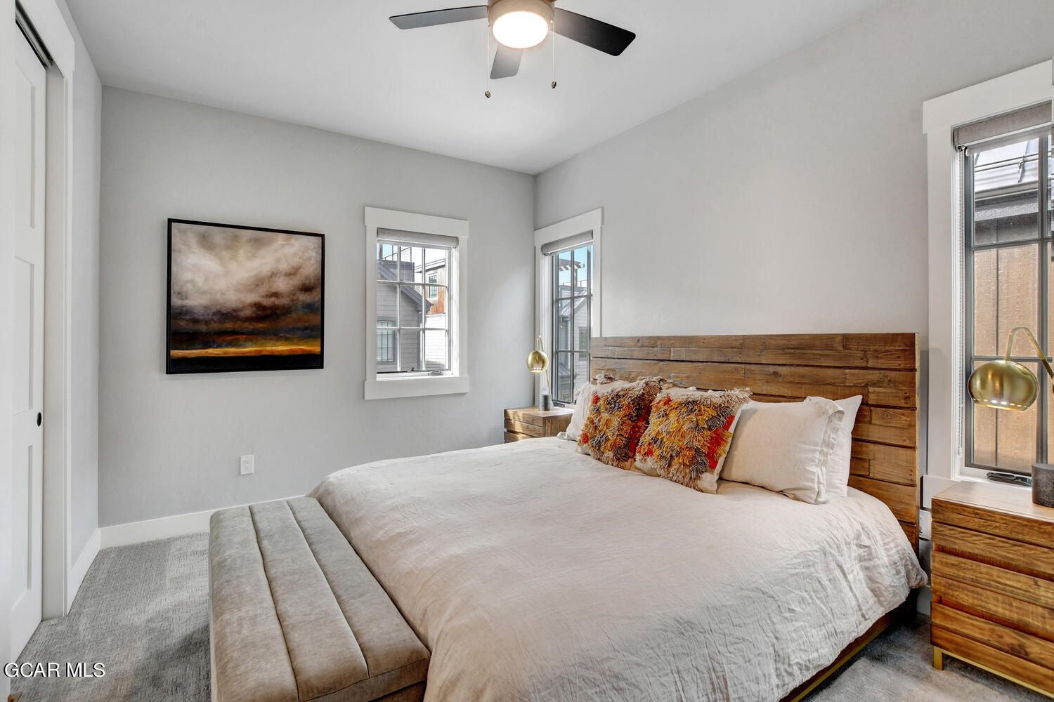Undisclosed Address Winter Park, CO 80482 - Photo 20 of 52 a bedroom with a large bed and a chandelier