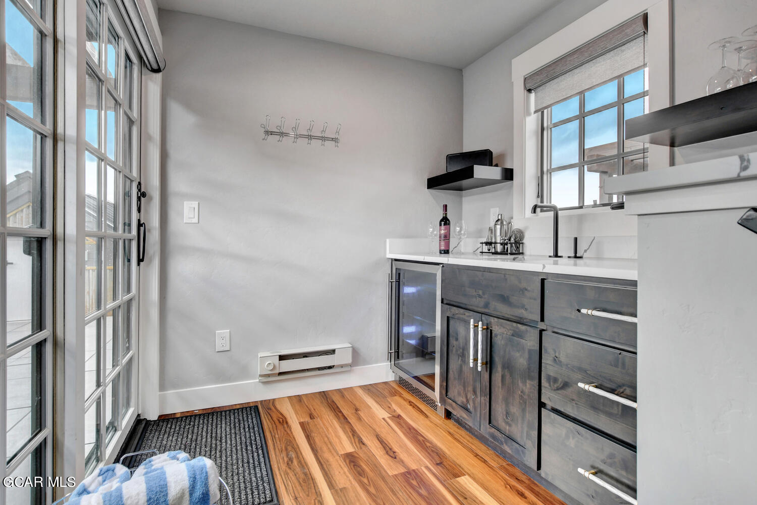 Undisclosed Address Winter Park, CO 80482 - Photo 30 of 52 a kitchen with a sink and wooden floor